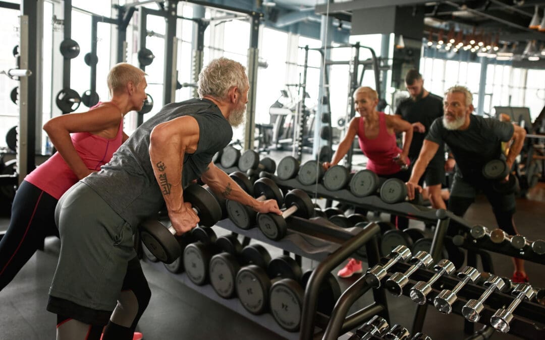 Couple in 50s at a group exercise class