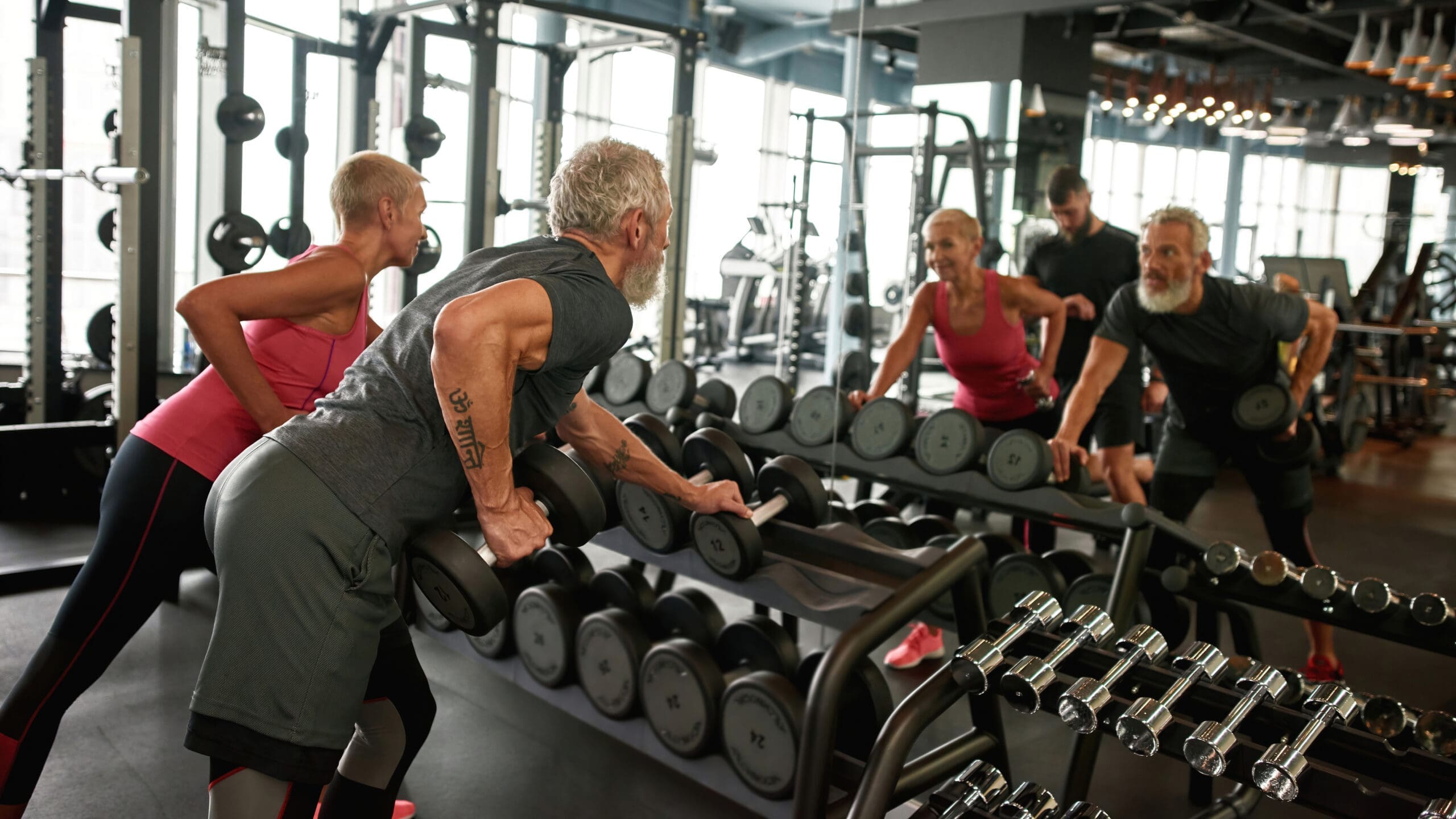 Couple in 50s at a group exercise class