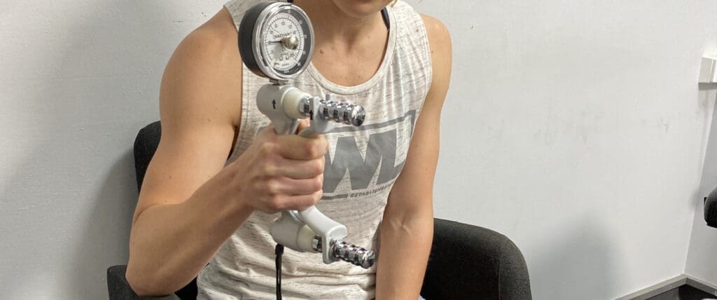 woman getting tested for muscle imbalance grip strength at iNform